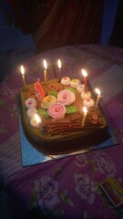 cake photo with candal, party , decorated cake, night 