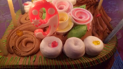 cake photo with candal, party , decorated cake, night 