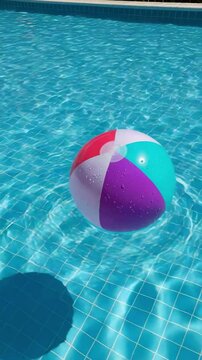 Colorful Beach Ball Floating in a Refreshing Swimming Pool Water
