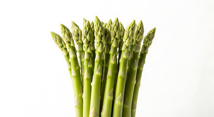 A bunch of fresh green asparagus spears clustered together on a plain white background in a studio shot