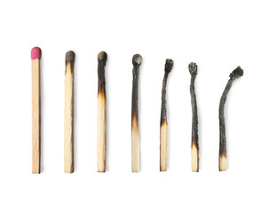 Burnt matches and whole one on white background