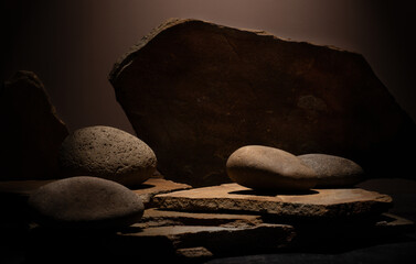 Composition with brown flat and smooth oval natural zen stones with texture for podium presentation...