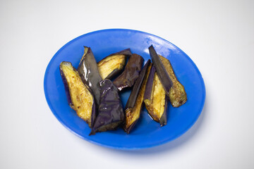 A plate of stir-fried eggplant is ready to be enjoyed as a friendly dish.