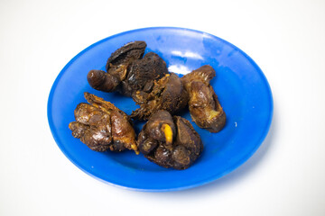 A portion of fried chicken liver, placed on a blue plate, ready to be eaten.