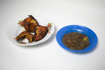 A simple yet delicious dish of fried chicken and homemade chili sauce.