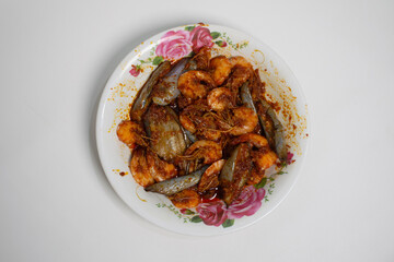 Traditional homemade shrimp and eggplant dish with bold, spicy flavors.