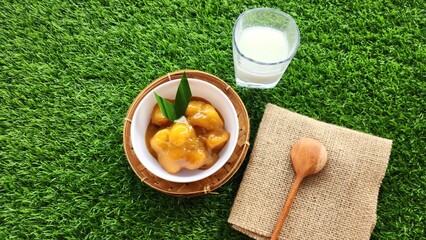 Candil porridge is made from sticky rice flour, brown sugar and coconut milk, shaped like balls or...
