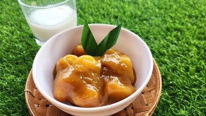 Candil porridge is made from sticky rice flour, brown sugar and coconut milk, shaped like balls or...