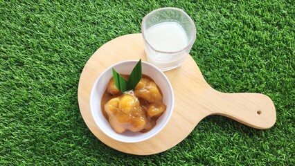 Candil porridge is made from sticky rice flour, brown sugar and coconut milk, shaped like balls or...