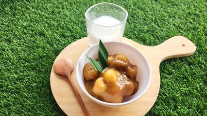 Candil porridge is made from sticky rice flour, brown sugar and coconut milk, shaped like balls or...