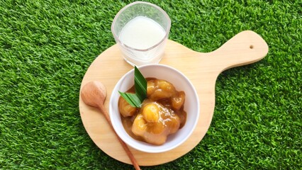 Candil porridge is made from sticky rice flour, brown sugar and coconut milk, shaped like balls or...