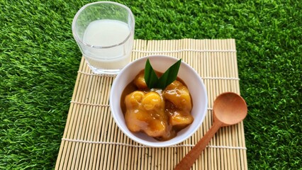 Candil porridge is made from sticky rice flour, brown sugar and coconut milk, shaped like balls or...