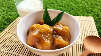 Candil porridge is made from sticky rice flour, brown sugar and coconut milk, shaped like balls or...