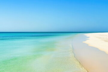 Obraz premium Pristine beach meets a vibrant turquoise sea under a clear sky