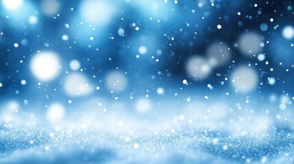 Fototapeta premium Close-up of soft glowing white particles floating over a blurry blue background creating a magical, serene, wintery atmosphere