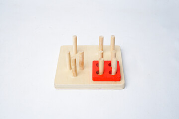 Montessori wooden toy with vertical pegs