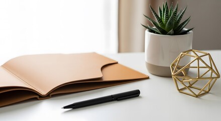 Minimalist Workspace with Notebook Pen and Succulent Plant Cultivating Focus Productivity and a Peaceful Working Environment at Home