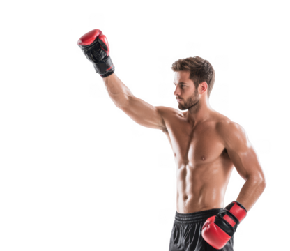A muscular male boxer raises his gloved hand in a victory pose against a plain white background. showcasing strength and determination. ideal for fitness or sports-related content