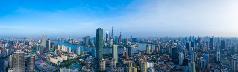 Panoramic Aerial view of Shanghai skyline and winding river on sunny day.