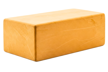 Large rectangular block of vibrant orange cheese isolated on a transparent background