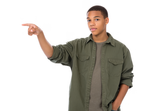 A young male in a green shirt points confidently to the right. showcasing a sense of direction and purpose. with a clean. white background emphasizing his gesture