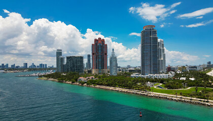 Obraz premium Aerial view of Miami Beach with turquoise waters. Drone shot of Miami skyline. Top view of South Beach. Miami cityscape with luxury skyscrapers and ocean. View of Miami famous coastline.