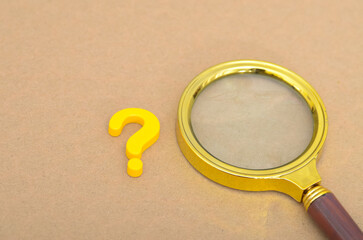 Yellow Question Mark with Magnifying Glass: Concept of Search, Inquiry, and Curiosity in Knowledge...