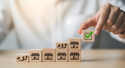 Franchise business growth and expansion concept. Hand stacking wooden blocks with store and arrow icons, franchise business growth, expansion, success entrepreneurship, market development, online shop