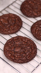 Fudgy Brownie Cookies combine the rich, chewy center of a brownie with the crisp edges of a cookie. With glossy, crackly tops and deep chocolate flavor, these cookies offer melt-in-your-mouth indulgen