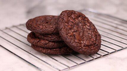 Fudgy Brownie Cookies combine the rich, chewy center of a brownie with the crisp edges of a cookie. With glossy, crackly tops and deep chocolate flavor, these cookies offer melt-in-your-mouth indulgen
