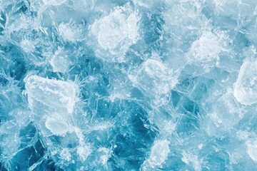 Fototapeta premium Frozen water crystals. A close-up view of fractured ice. Intricate patterns of ice shards and crystals. Cool blue tones