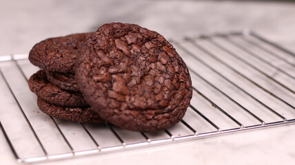 Fudgy Brownie Cookies combine the rich, chewy center of a brownie with the crisp edges of a cookie. With glossy, crackly tops and deep chocolate flavor, these cookies offer melt-in-your-mouth indulgen
