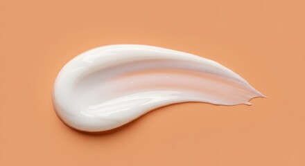 White cream smear on peach background