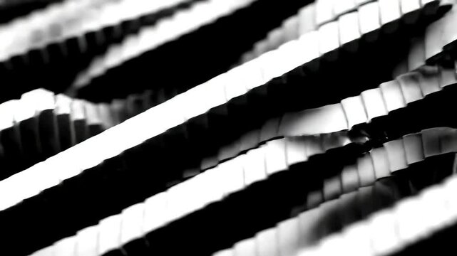 Black and white image of parallel rows of rectangular shapes with gaps