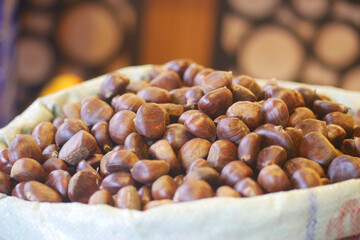 Chestnuts displayed in a market during autumn season
