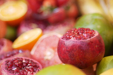 Colorful assortment of pomegranates and citrus fruits
