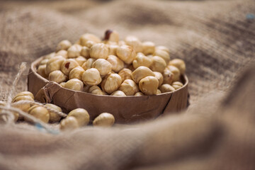 Hazelnuts and Almonds in Paper Containers on White Background – Isolated Nuts