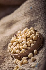 Hazelnuts and Almonds in Paper Containers on White Background – Isolated Nuts