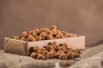 Marinated Nuts with Brown Sauce and Sesame on White Background– Rustic Gourmet Snack