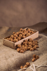 Marinated Nuts with Brown Sauce and Sesame on White Background– Rustic Gourmet Snack