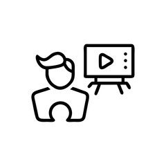 Person standing next to a screen displaying a play button on a stand