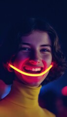 Portrait of a laughing woman with a neon light smile
