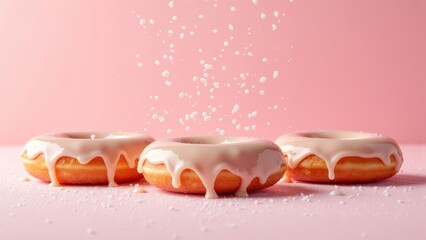 Delicious Glazed Donuts on Pink Background with Sugar Sprinkles