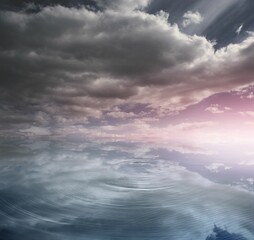Water reflecting stormy sky