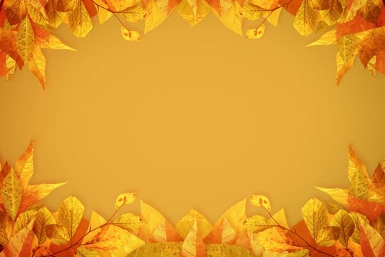 Fototapeta Decorative autumn leaf border is framing golden-yellow background in flat design, copy space