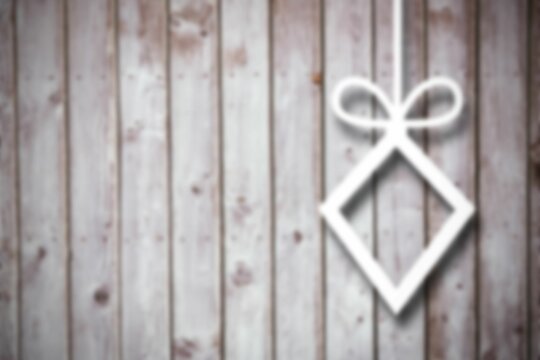 Fototapeta Blurred christmas decorations on wood