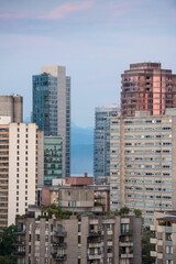 Modern towers in city against sky