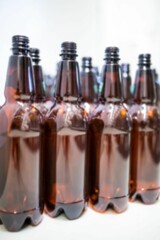 Close-up of beer bottles in row