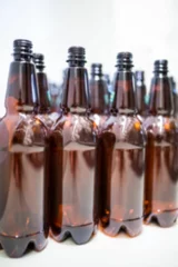 Selbstklebende Fototapeten Close-up of beer bottles in row © vectorfusionart