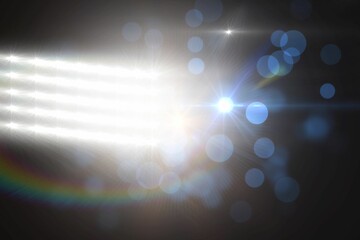 Vector illustration showing LED light array shining in dark studio, creating starburst lens flares